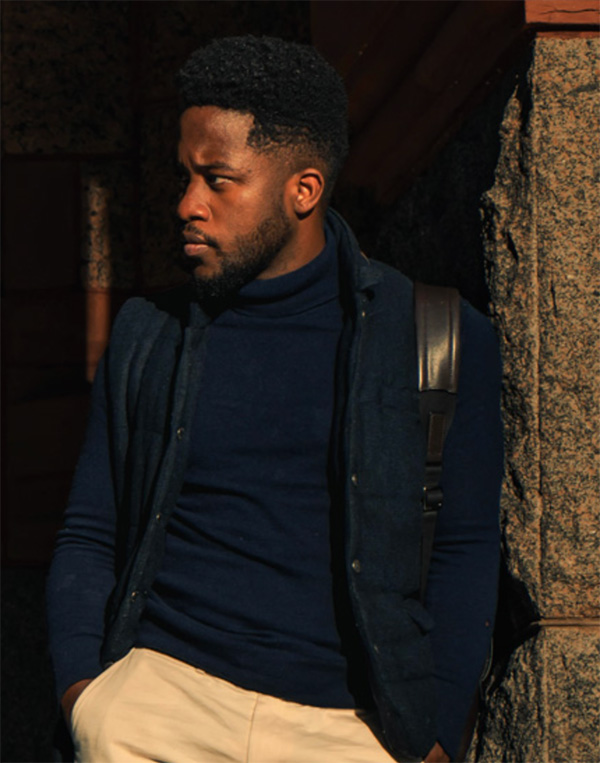 man wearing navy turtleneck sweater