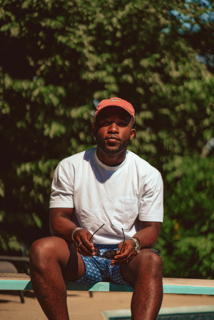 man wearing a summer outwith with a white pocket tee