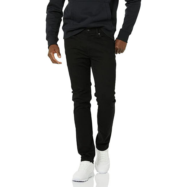a person wearing black slim fit jeans