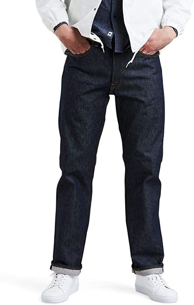 a person wearing dark denim shrink to fit regular fit jeans