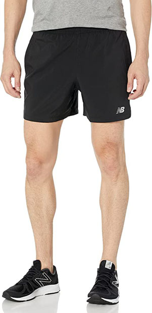 a close-up of a person wearing black shorts