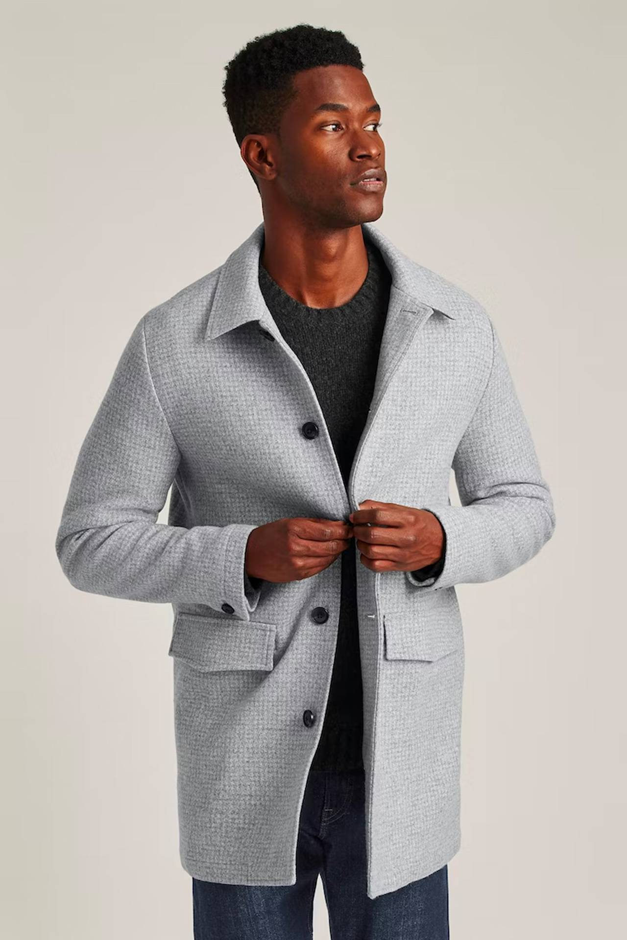a man wearing a grey wool car coat