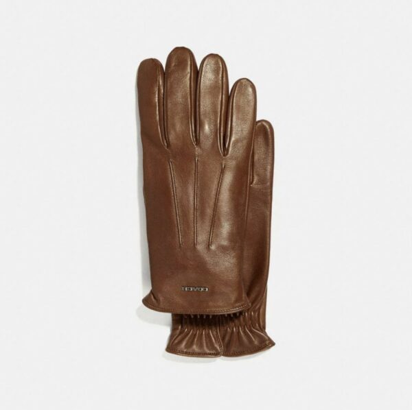 a pair of brown leather driving style gloves