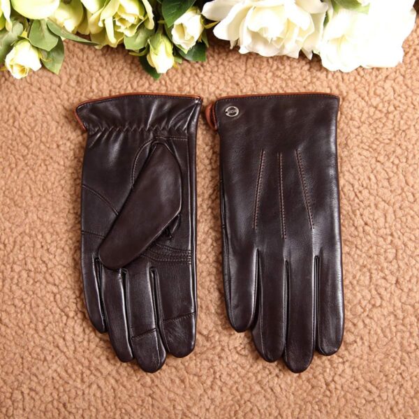a pair of brown leather gloves