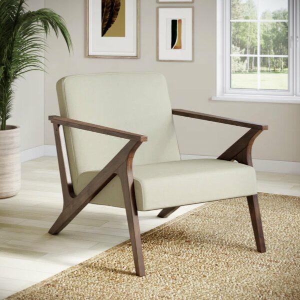 a beige fabric and wood frame armchair