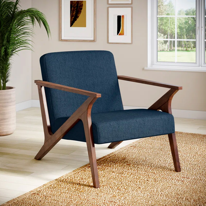 a navy fabric and wood frame armchair