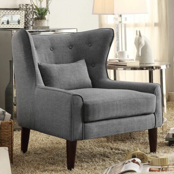 a grey upholstered and wood leg armchair