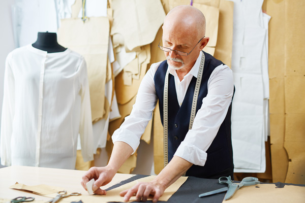 a tailor marking clothing