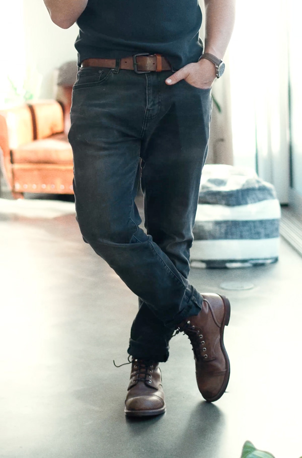 black jeans with brown boots and brown belt and brown watch
