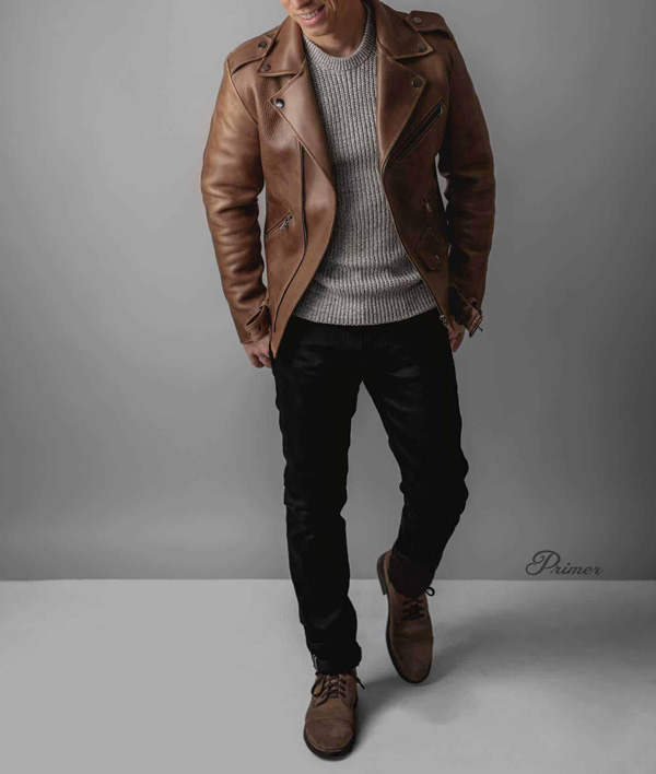 brown leather jacket with sweater, black jeans, and brown leather boots