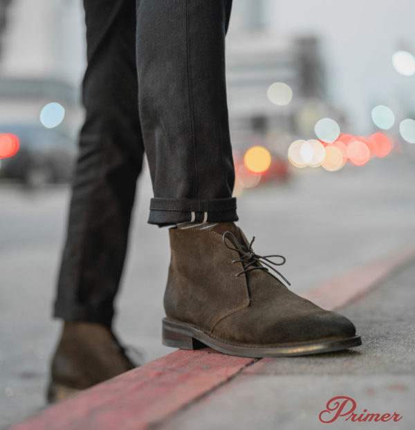 brown chukka boots with black jeans