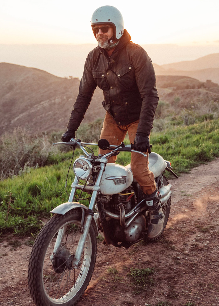 man on motorcycle wearing a waxed canvas jacket