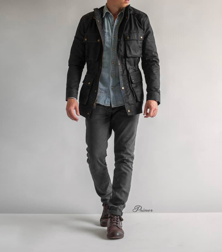 waxed cotton jacket outfit with denim shirt and gray jeans