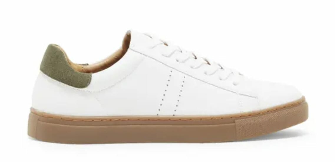 a low top white and green gum sole shoe