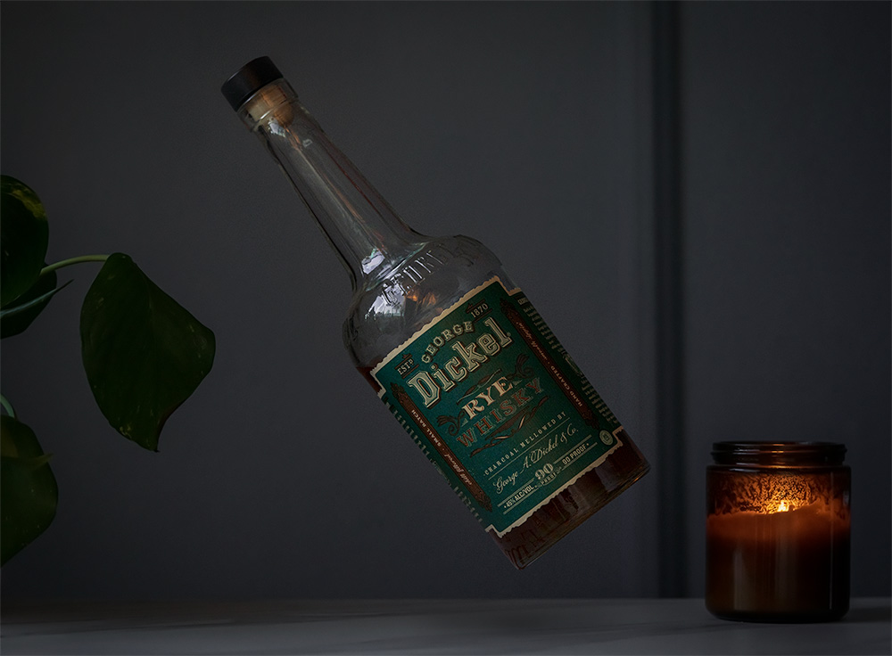 a bottle of george dickel rye whisky floating