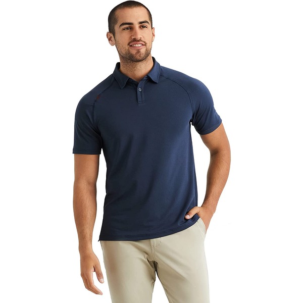 a man wearing a short sleeve polo shirt and khaki pants