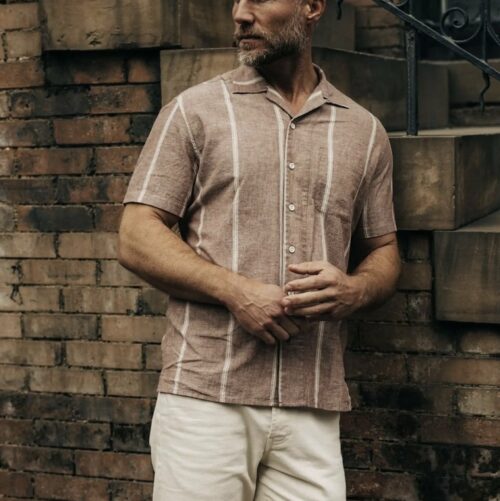 a man wearing a short sleeve button front shirt