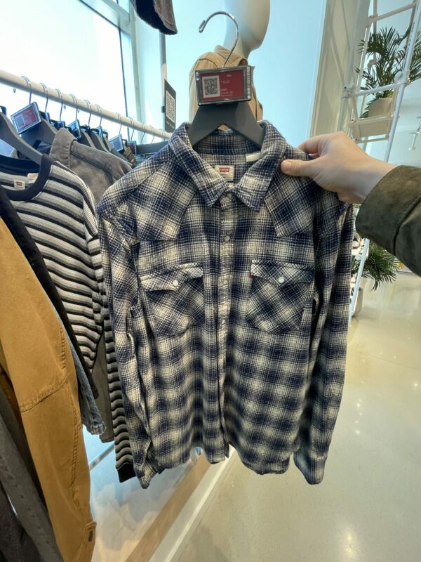 a plaid pattern button front western style long sleeve shirt