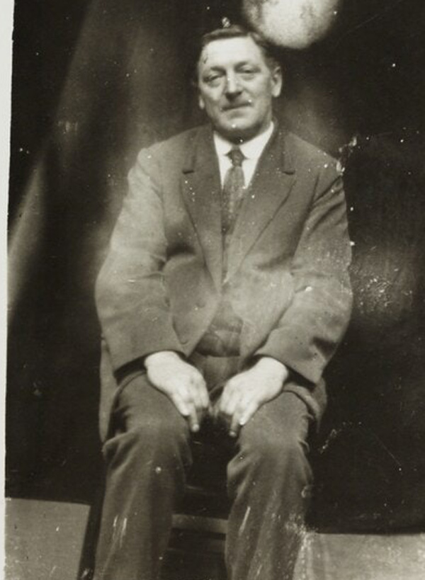 a man from 1922 wearing a suit