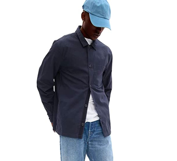 a man wearing a blue utility style jacket