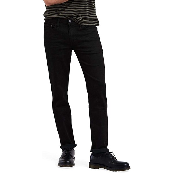 a man wearing slim fit jeans and boots