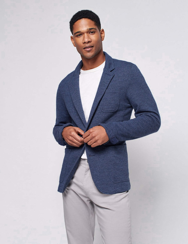 man wearing navy blazer with t-shirt