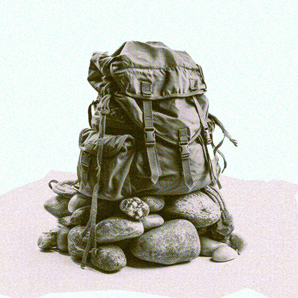 a backpack sitting on a pile os stones