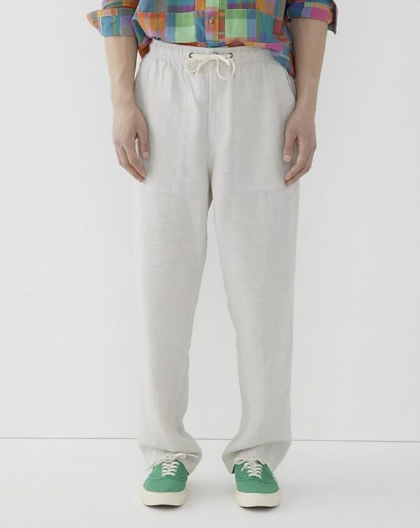man wearing drawstring waist linen pant with low top sneakers