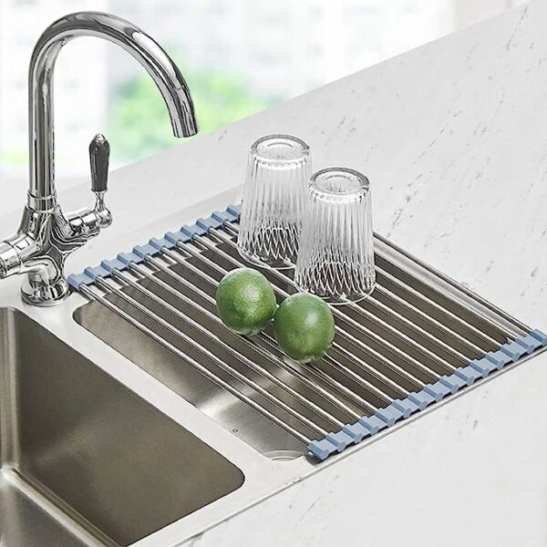 an over the sink drying rack with two glasses and limes on the surface