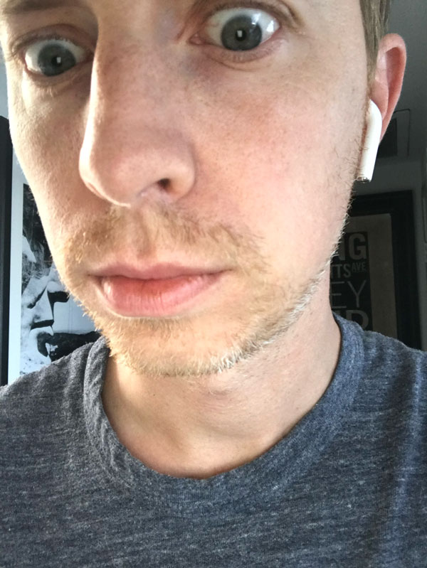 early beard growth on man's face