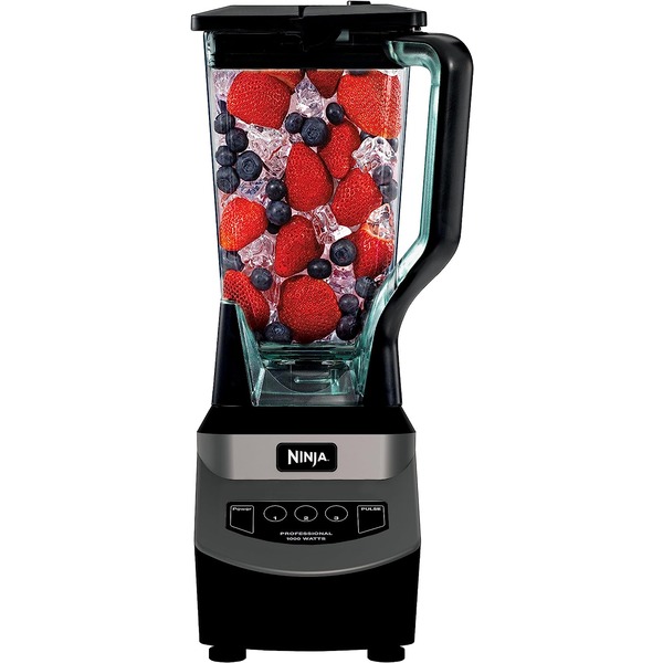 a blender containing fruits and ice