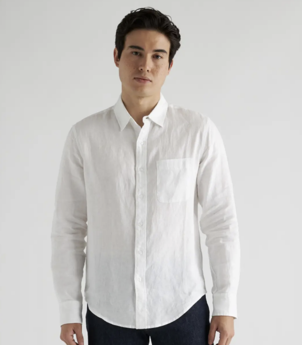 a man wearing a long sleeve button front linen shirt
