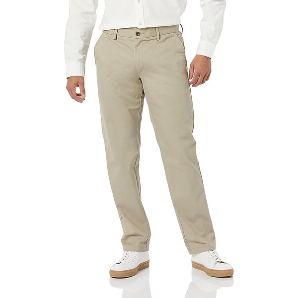 a man wearing straight fit flat front chino pants with sneakers