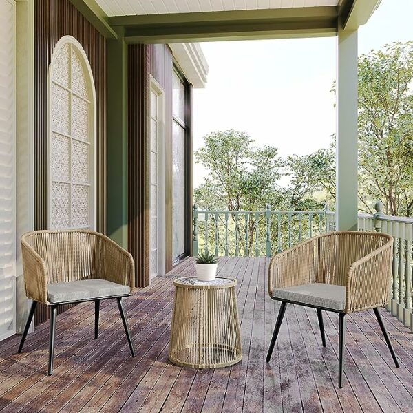 rattan patio furniture including two chairs and a tempered glass top table on a porch patio