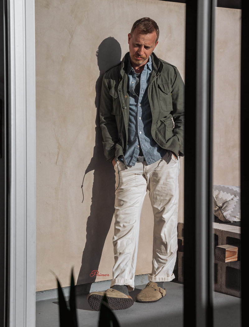 fall outfit with birkenstock clog mules featuring white pants and olive jacket