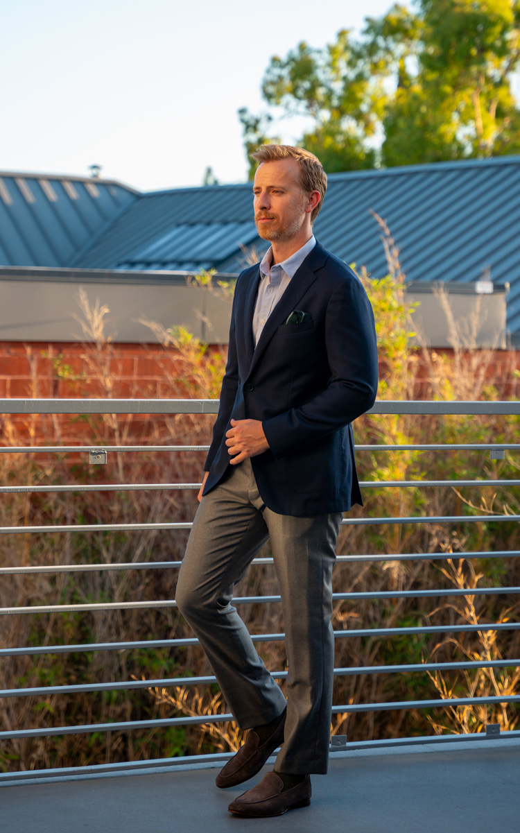 business casual outfit with a blazer without a tie: navy blazer, button up shirt, gray dress pants and brown suede loafers
