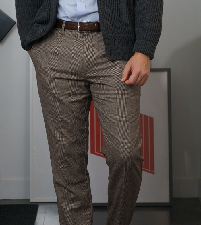 man wearing brown glen check dress pants