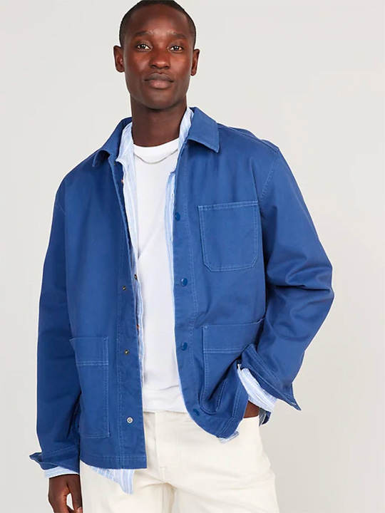 a bright blue chore coat on a model