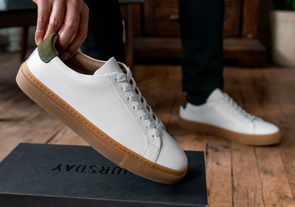 white gum sole sneakers with green accent on heel