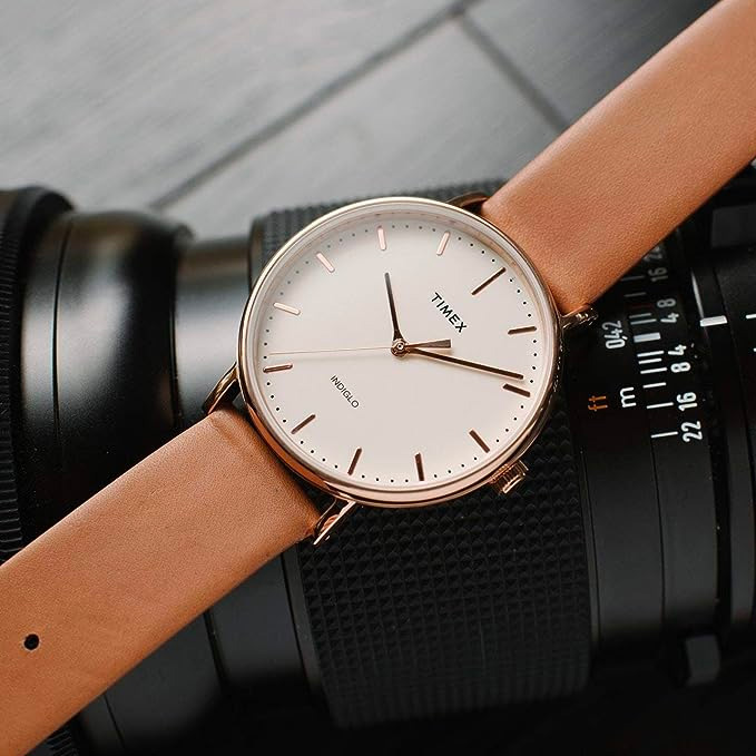 timex watch with tan strap and rose gold metal accents