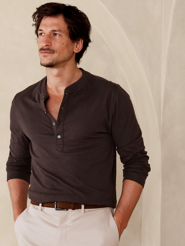 man wearing a brown henley long sleeve shirt