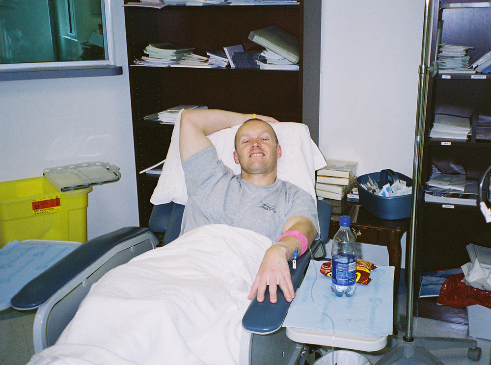 borland receiving treatment in a clinic bed