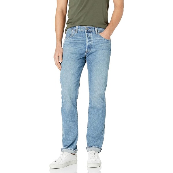 a man wearing denim jeans with casual shoes