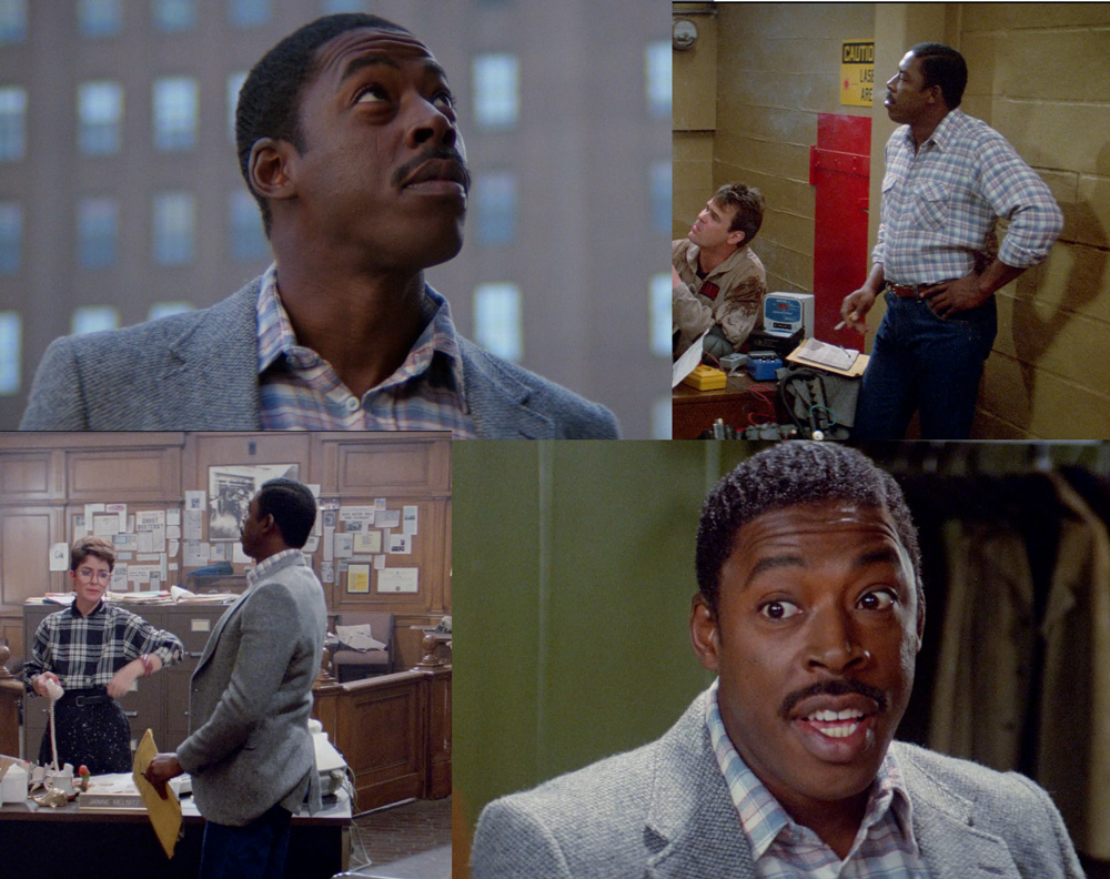 Collage of four stills featuring Winston Zeddemore from 'Ghostbusters.' In the images, he wears a light-gray blazer over a blue and white checkered shirt, paired with dark blue trousers. In various scenes, he is shown looking up, standing in an office, conversing with a colleague, and providing a close-up of his face.