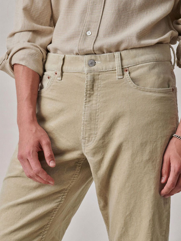 close up of the waist of tan fine wale corduroy pants