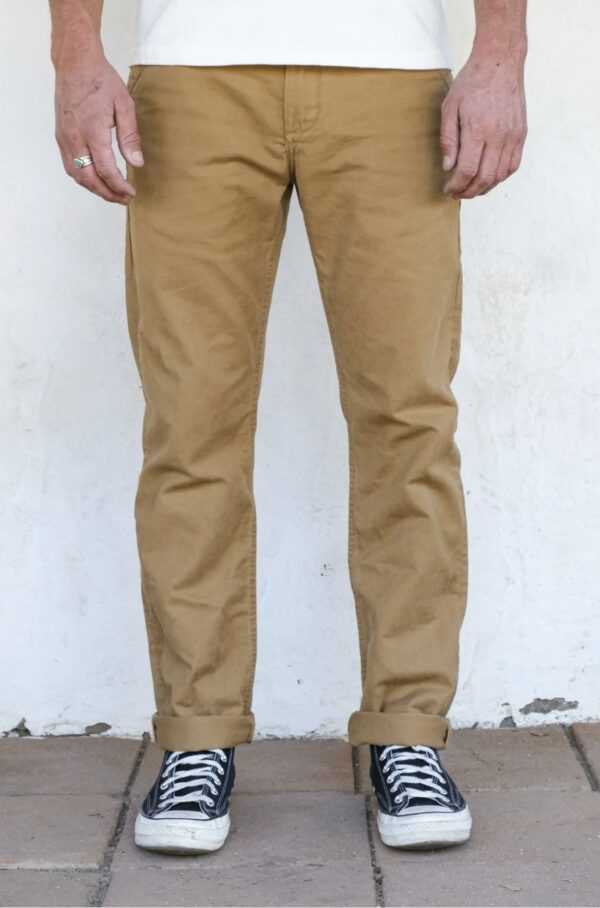 a man wearing slim fit chinos and work boots