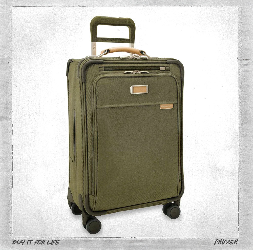 a green briggs and riley spinner suit case