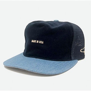 a corduroy and denim trucker style hat