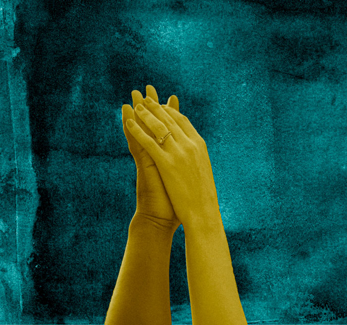 two hands touching on textured background