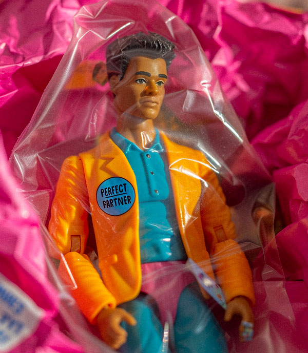 a toy action figure for the Perfect Partner in its packaging